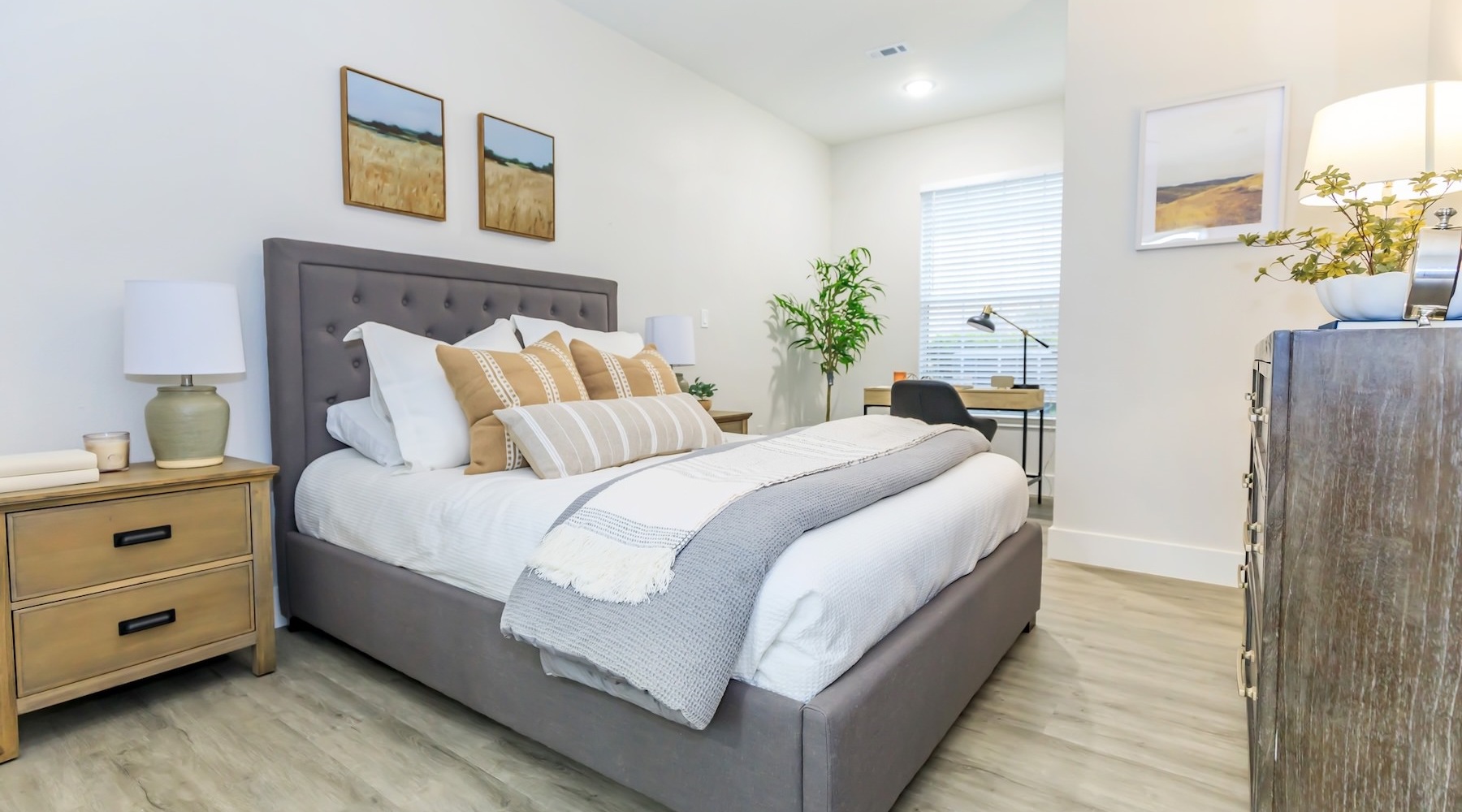 a bedroom with a bed and two nightstands