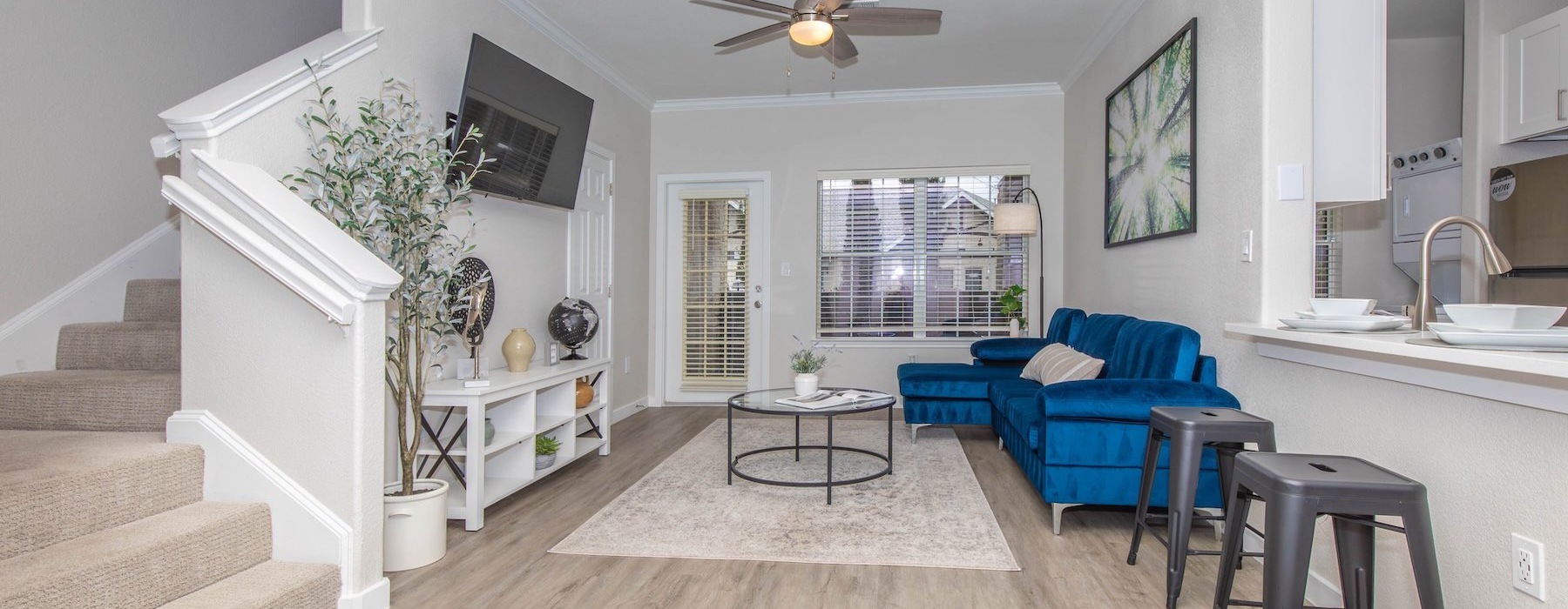 a living room with a couch and a tv