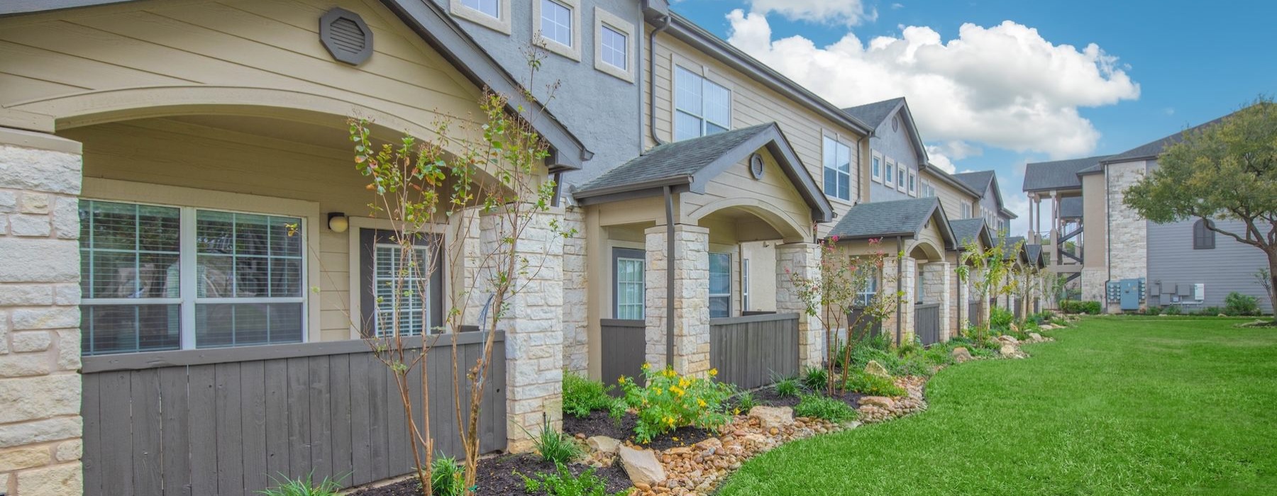 a house with a yard and a fence