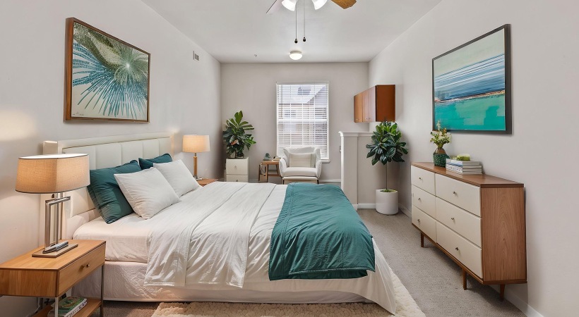 bedroom with bed end table and lamps