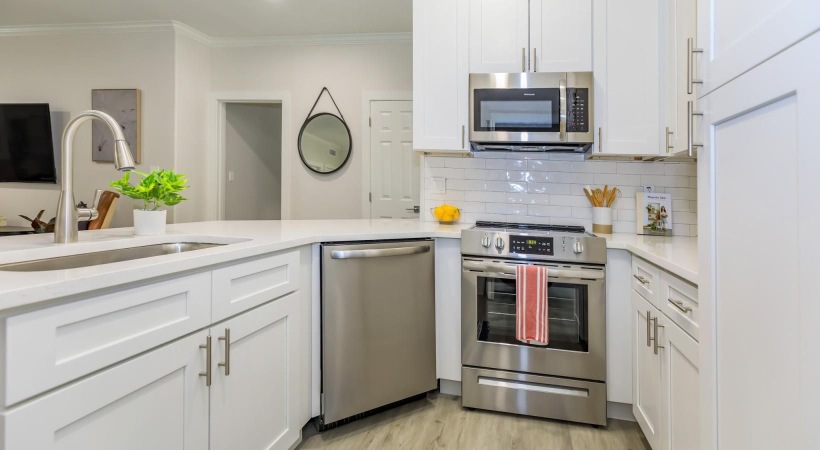 a kitchen with white cabinets