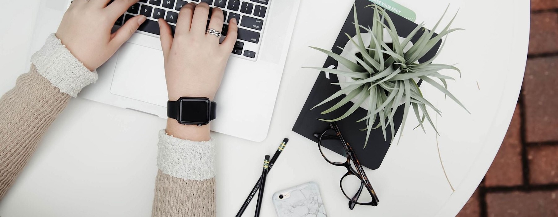 a person typing on a laptop